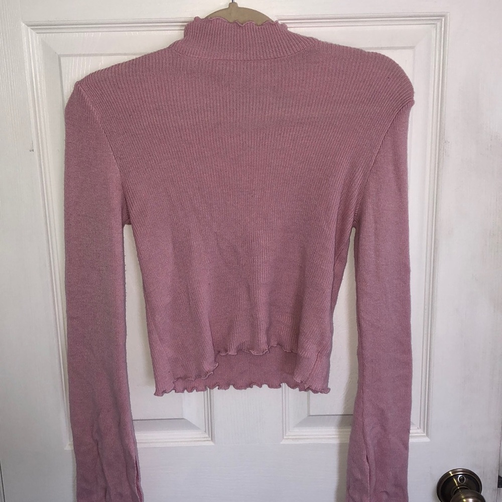 Pink turtleneck with flare sleeves